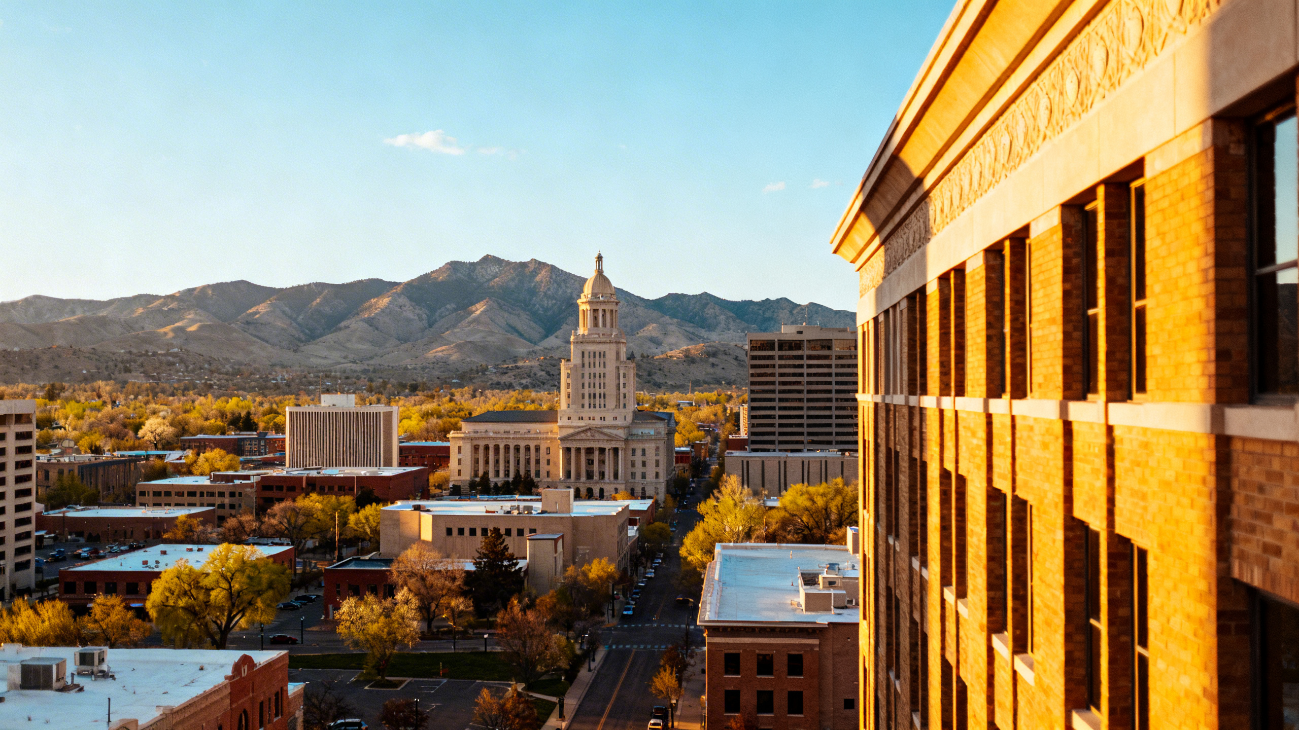 Boise downtown area with mountain views in the background under a bright, clear spring day