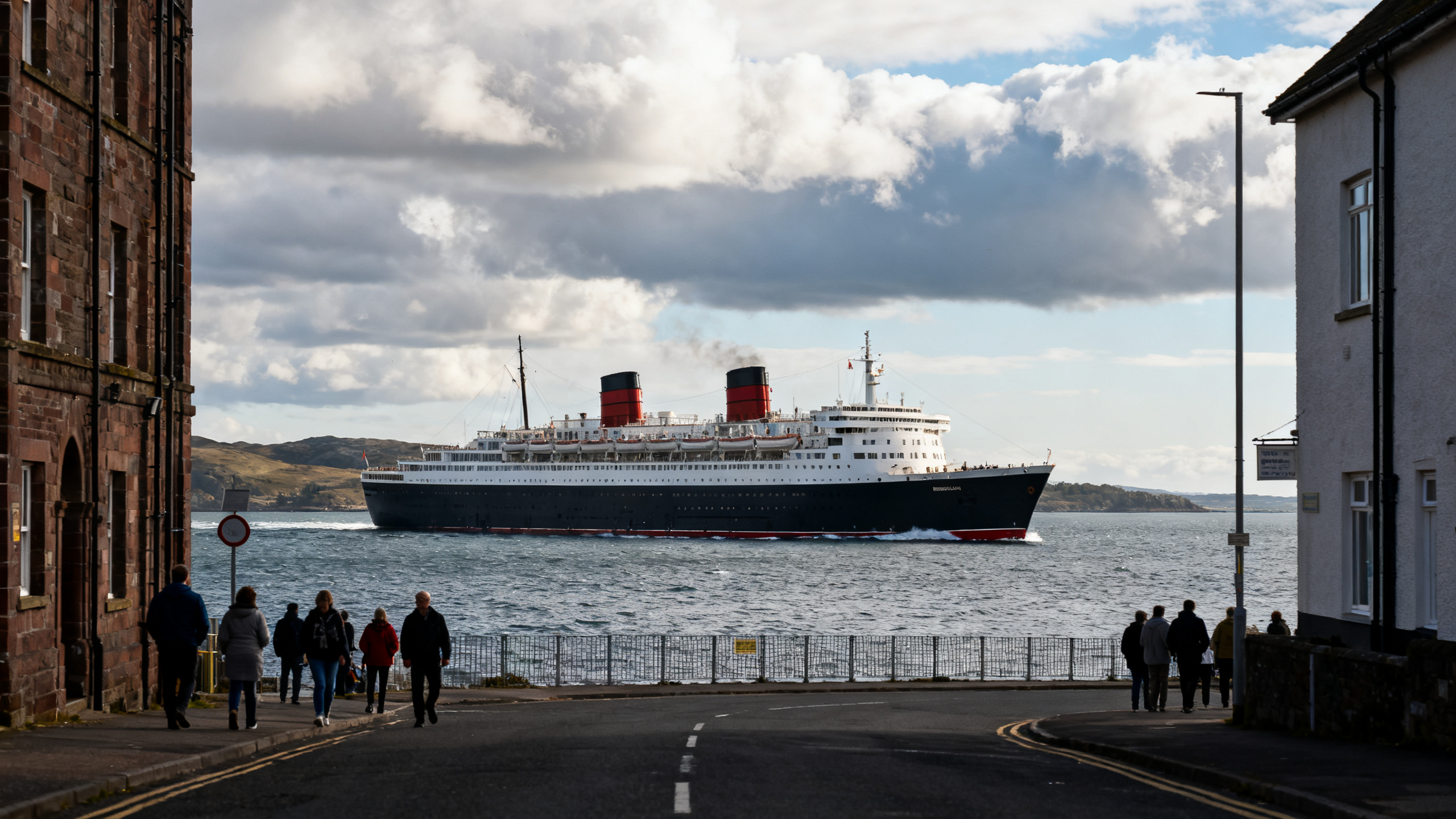 A stately Cunard ocean liner cruising through cool northern waters, with a cloud-dappled sky and the ship’s classic white and black exterior gleaming.