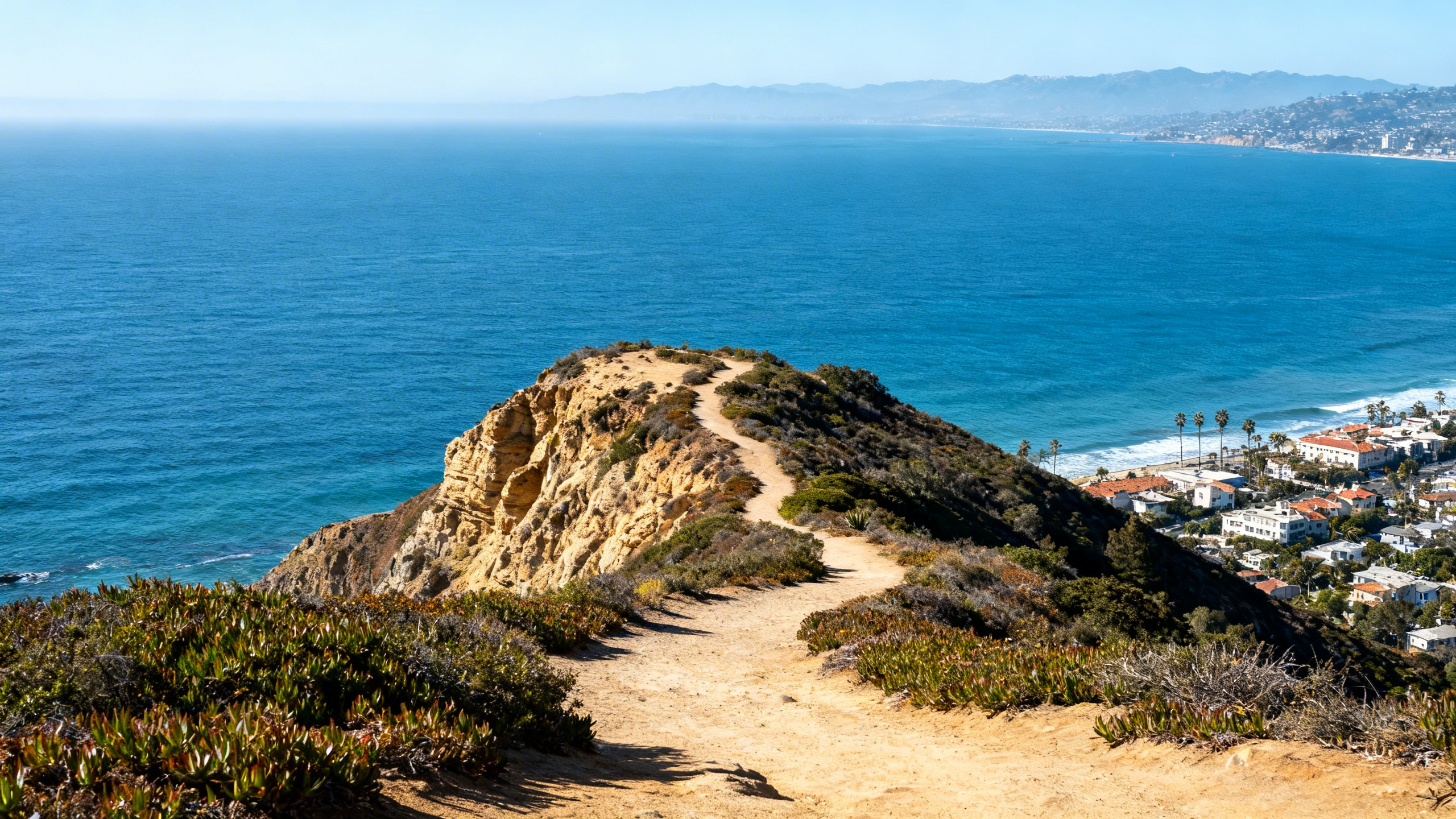 Clifftop views overlooking the Pacific Ocean and coastal trails at Rancho Palos Verdes, California on a clear day