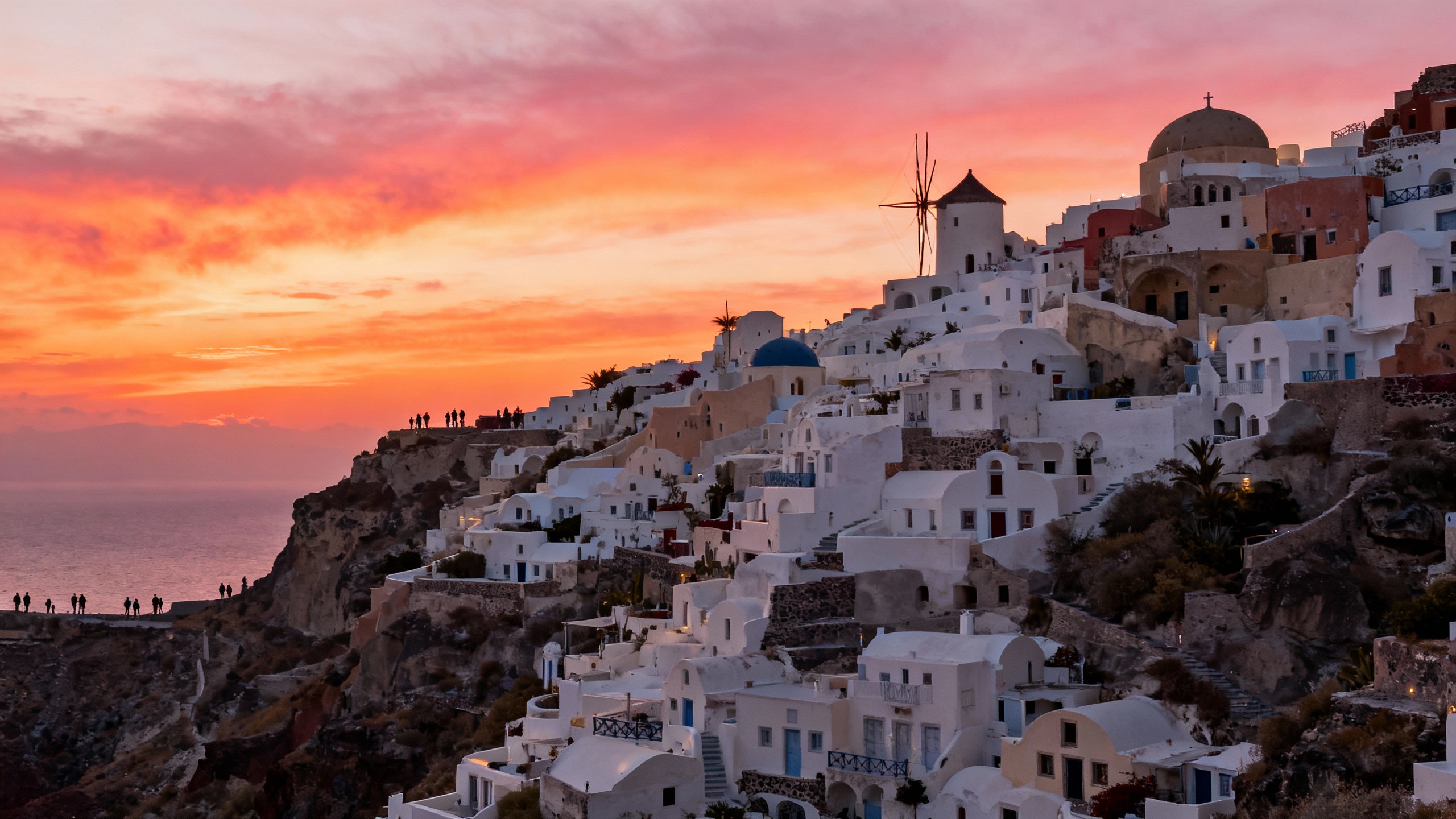 Oia Santorini Greece white buildings sunset