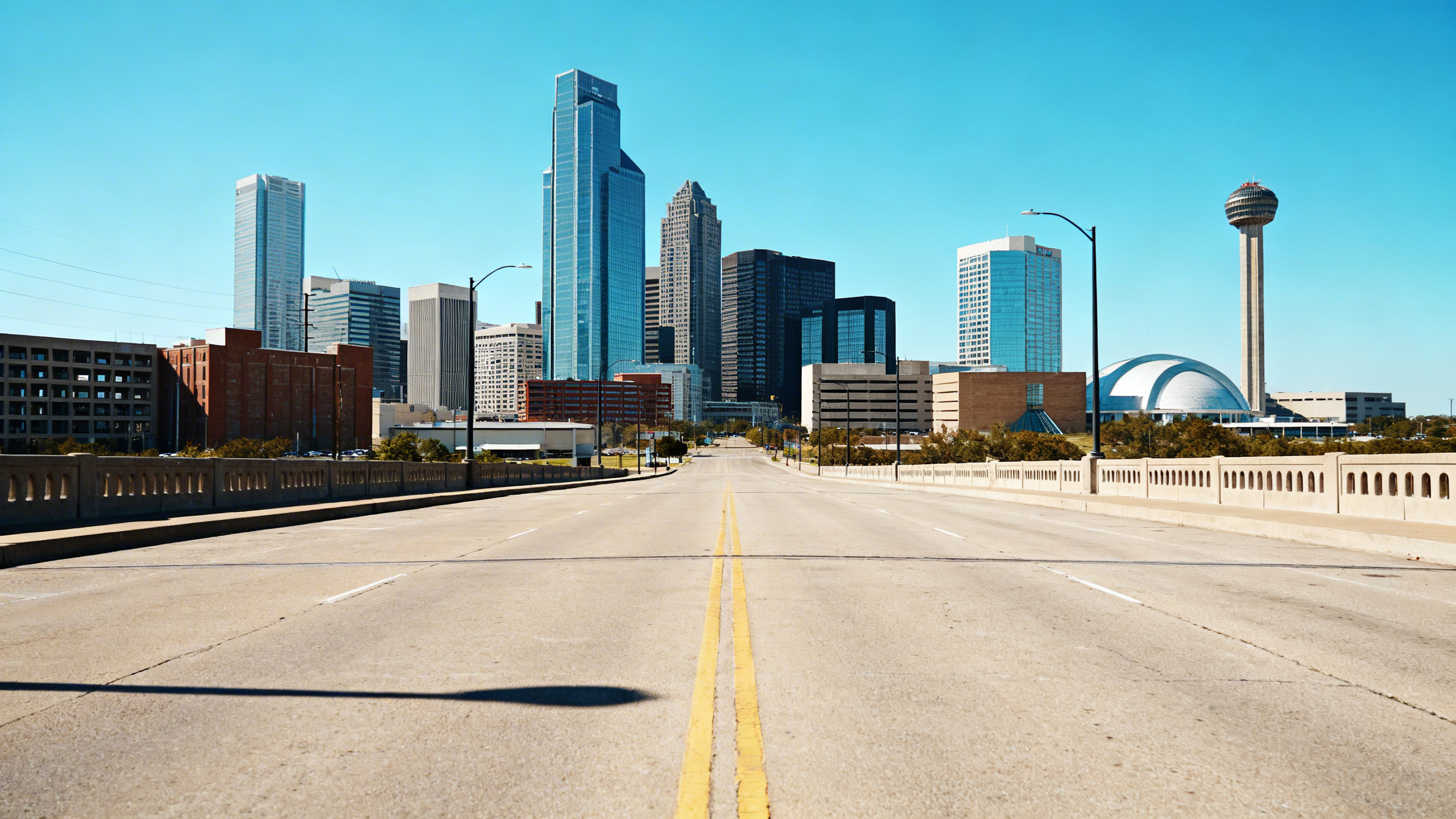 Downtown Dallas skyline featuring high-rise buildings and urban streets with little coastal presence.