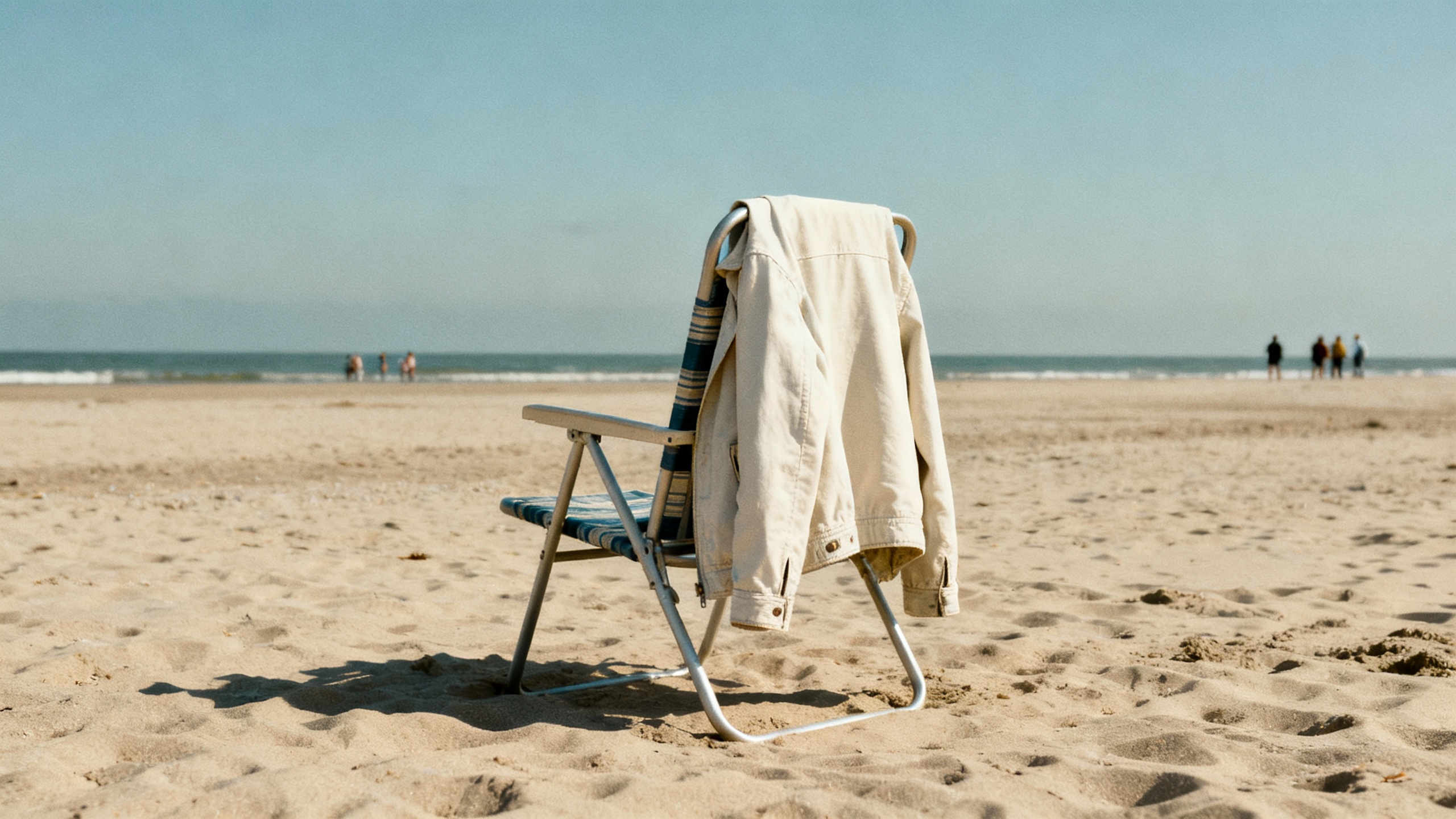 light jacket draped over beach chair