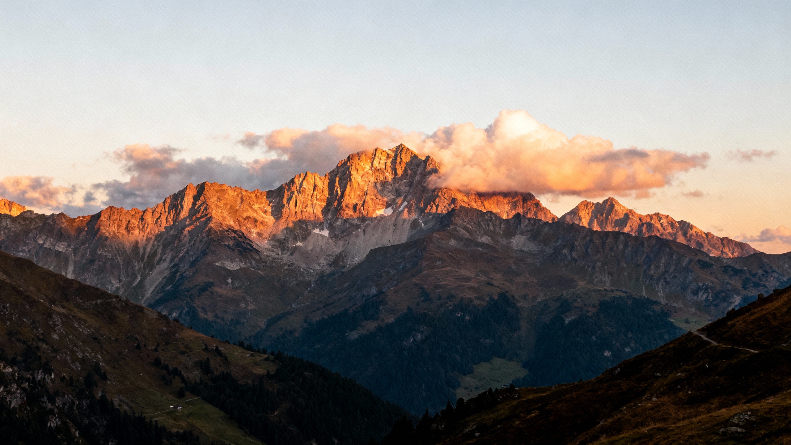 Mountain peaks sunrise clouds alpine landscape