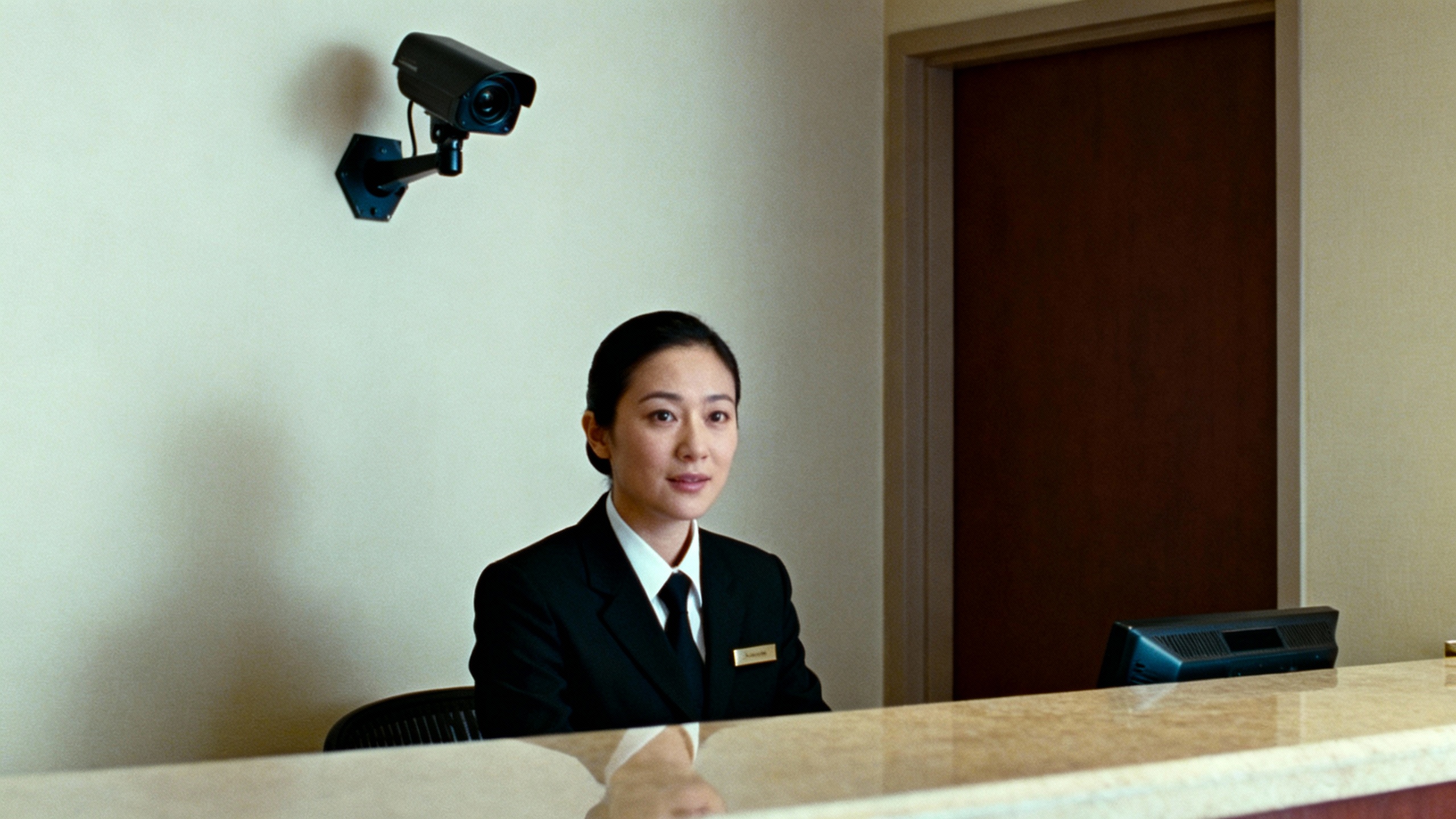 hotel security camera and staff at desk