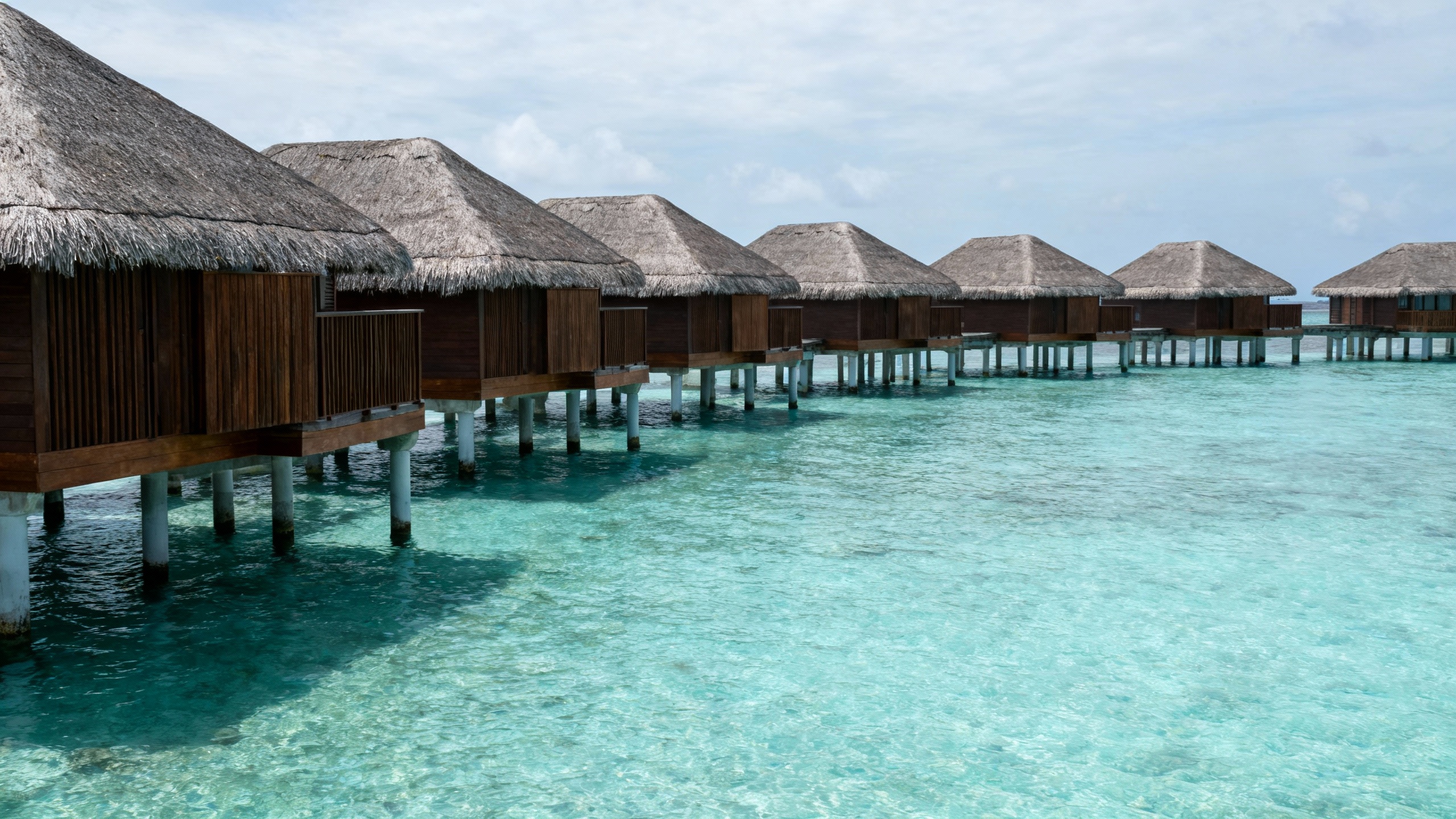 Maldives crystal clear water overwater bungalows
