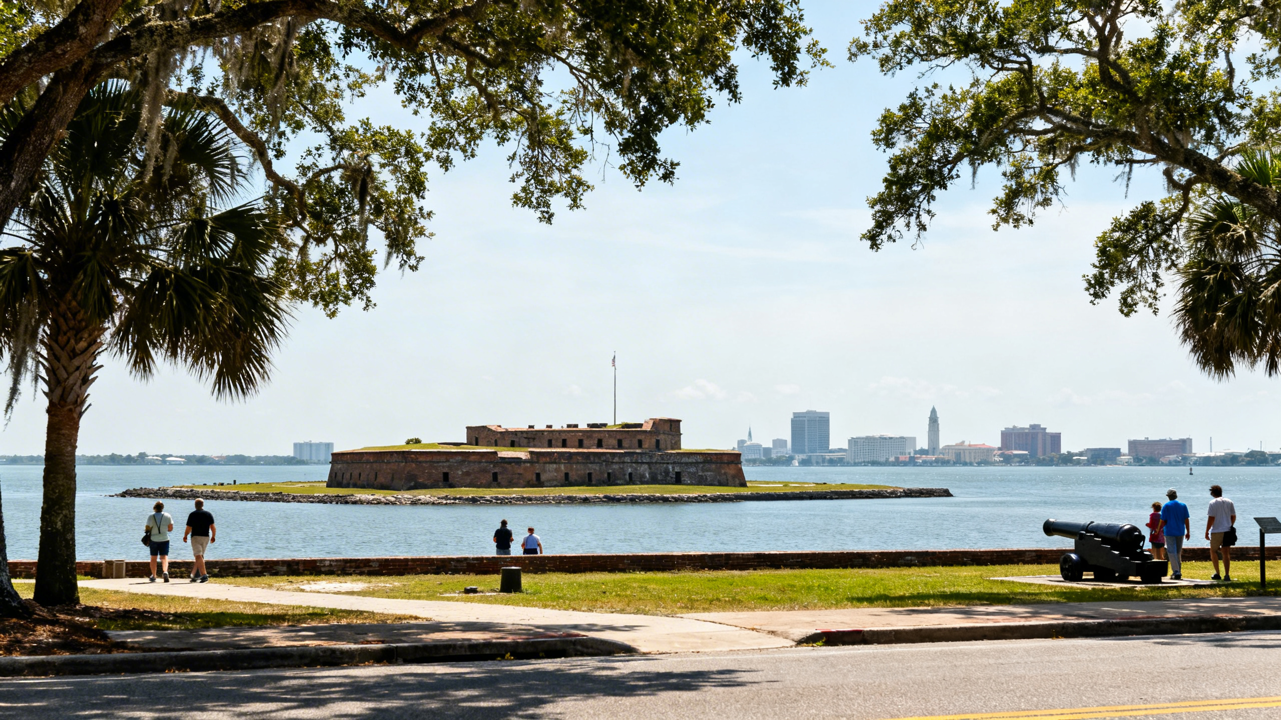 The historic Fort Sumter island fortress surrounded by calm harbor waters with Charleston’s skyline in the distance on a sunny day