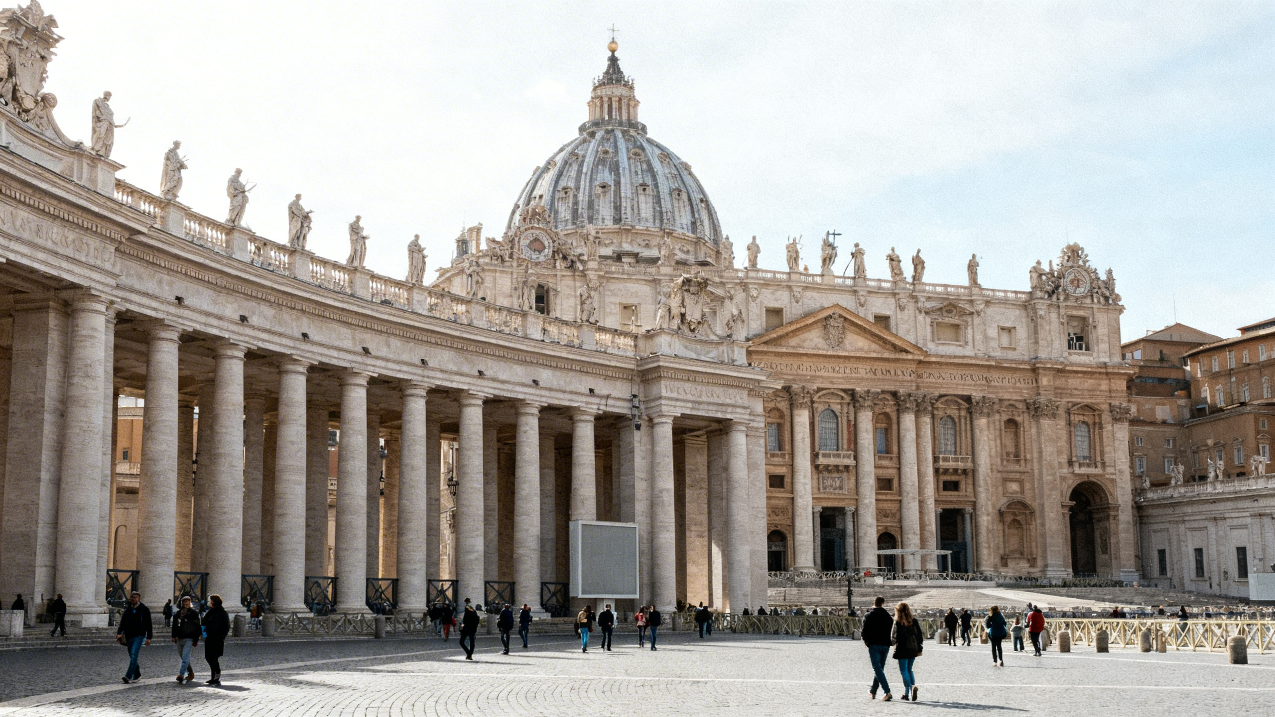 The magnificent exterior of St. Peter’s Basilica with its grand columns and towering dome against a bright sky