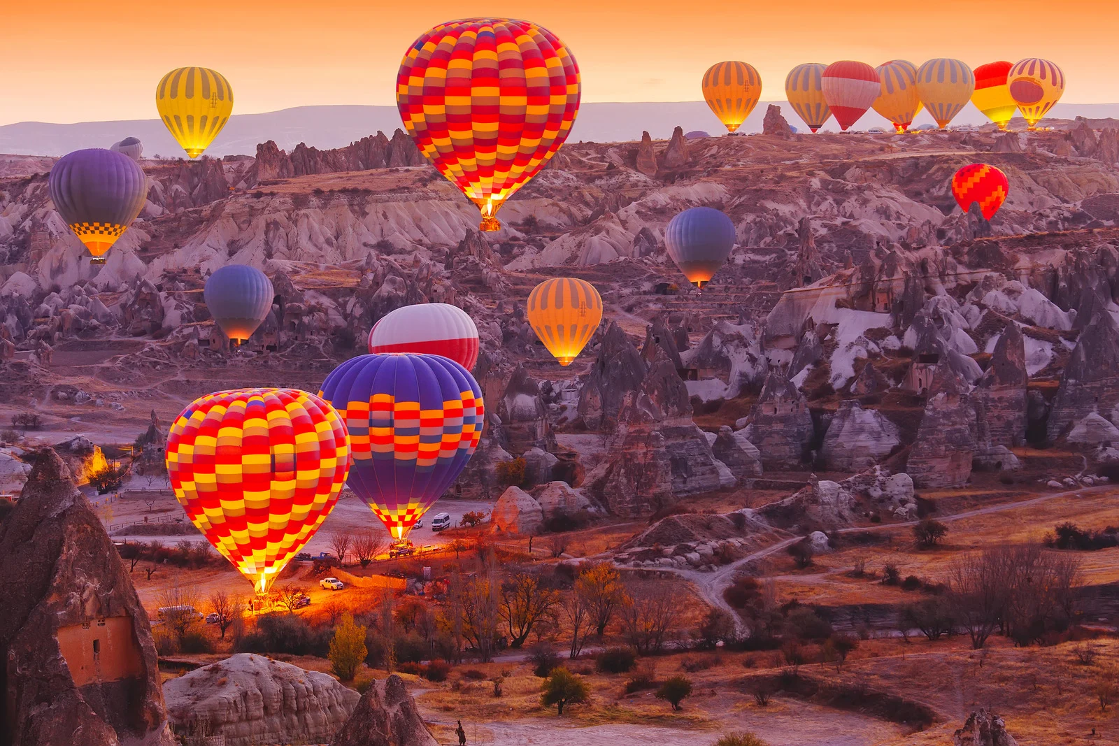 Soar Over Cappadocia’s Enchanting Landscapes at Dawn