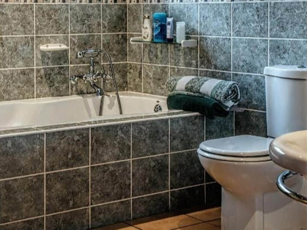 Use Steam from Your Shower to Smooth Wrinkled Clothes